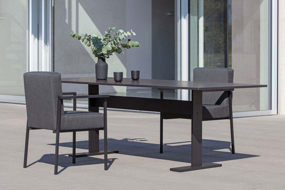 Outdoor dining upholstered chair and ceramic garden table